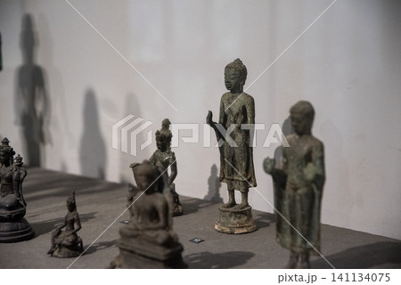 Collection of statues of Buddha and other figures Collection of statues of Buddha and other figures 141134075
