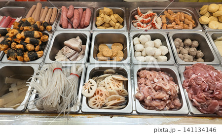 This selection of ingredients is typically found at a Malatang or steamboat buffet restaurant This selection of ingredients is typically found at a Malatang or steamboat buffet restaurant 141134146