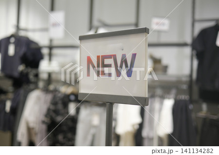 New arrivals displayed in a trendy clothing store section 141134282