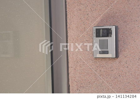 Video doorbell mounted on exterior wall of home Video doorbell mounted on exterior wall of home 141134284