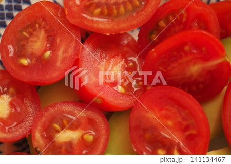 Fresh cut tomatoes ready for a healthy meal preparation Fresh cut tomatoes ready for a healthy meal preparation 141134467