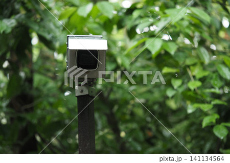 outdoor surveillance camera commonly used for security or traffic monitoring, often mounted on a pole or structure outdoor surveillance camera commonly used for security or traffic monitoring, often mounted on a pole or structure 141134564