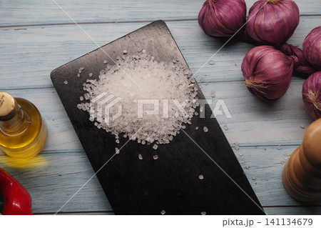 Cooking ingredients are arranged on a kitchen table Cooking ingredients are arranged on a kitchen table 141134679