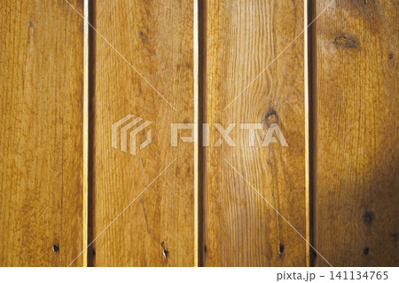 Wooden planks create a warm and rustic backdrop Wooden planks create a warm and rustic backdrop 141134765