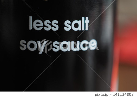 Soy sauce bottle with less salt label in focus 141134808