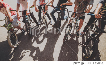 Company of young men on BMX at the skatepark 141135064