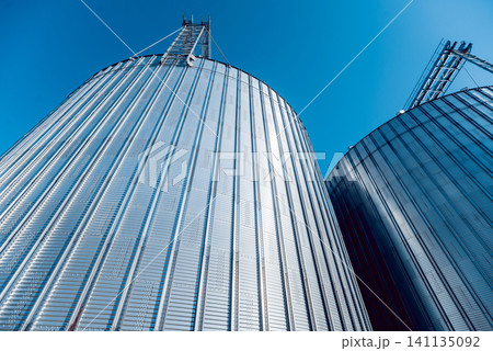 Modern silos for storing grain harvest. Agriculture. Modern silos for storing grain harvest. Agriculture. 141135092