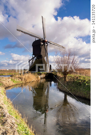 Windmill the Uitwijkse Molen near the Dutch village Almkerk 141135720