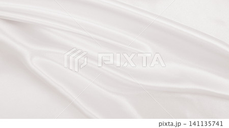 Smooth elegant golden silk or satin luxury cloth texture as wedding background. Luxurious background design. In Sepia toned. Retro style Smooth elegant golden silk or satin luxury cloth texture as wedding background. Luxurious background design. In Sepia toned. Retro style 141135741