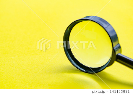Close up of magnifying glass with customizable space for text or ideas. Close up of magnifying glass with customizable space for text or ideas. 141135951