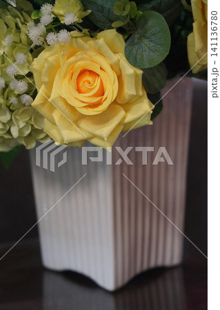 front view closeup large yellow rose flower and white and flowers bouquet in white ceramic vase, on wooden floor background, nature, fashion, love, decor, valentine front view closeup large yellow rose flower and white and flowers bouquet in white ceramic vase, on wooden floor background, nature, fashion, love, decor, valentine 141136780
