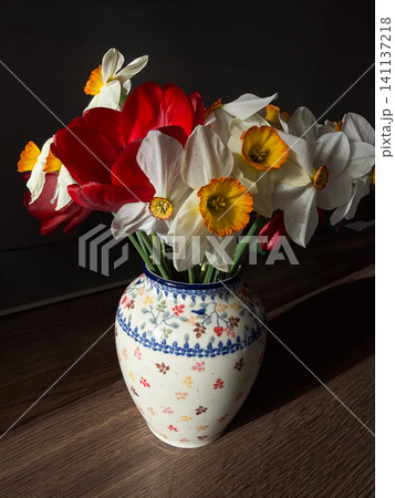 Still life featuring spring bouquet in patterned vase Still life featuring spring bouquet in patterned vase 141137218