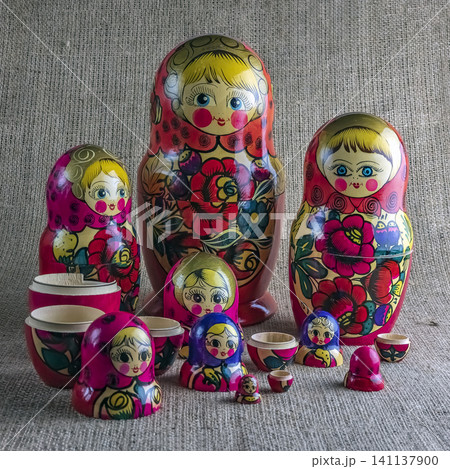 Traditional Wooden Matryoshka Nesting Doll Collection Displayed Together Traditional Wooden Matryoshka Nesting Doll Collection Displayed Together 141137900