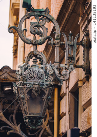 Old vintage metal lanterns or street lamps on building of Opera de Nice, France Old vintage metal lanterns or street lamps on building of Opera de Nice, France 141138193