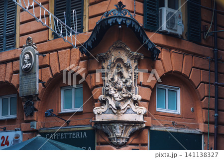 GENOA, ITALY - NOVEMBER 04, 2018 - Madonna shrine on the facade of the old house in Genoa GENOA, ITALY - NOVEMBER 04, 2018 - Madonna shrine on the facade of the old house in Genoa 141138327