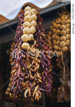 Dried herbs, spices, garlic and pepper hung Dried herbs, spices, garlic and pepper hung 141138556