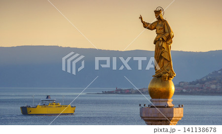 MESSINA, ITALY - NOVEMBER 06, 2018 - Close-up of the statue of Saint Mary or Madonna Della Lettera with the ship and the sea MESSINA, ITALY - NOVEMBER 06, 2018 - Close-up of the statue of Saint Mary or Madonna Della Lettera with the ship and the sea 141138678