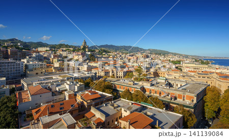 Panoramic top view of the local buildings with the trees, mountains and the sky in the beautiful city of Messina, Sicily, Italy Panoramic top view of the local buildings with the trees, mountains and the sky in the beautiful city of Messina, Sicily, Italy 141139084