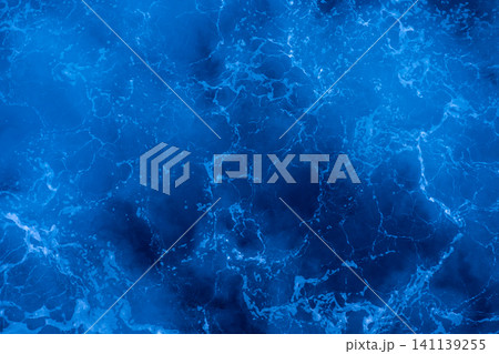 Rough deep turquoise and blue Mediterranean sea with white foam texture background Rough deep turquoise and blue Mediterranean sea with white foam texture background 141139255