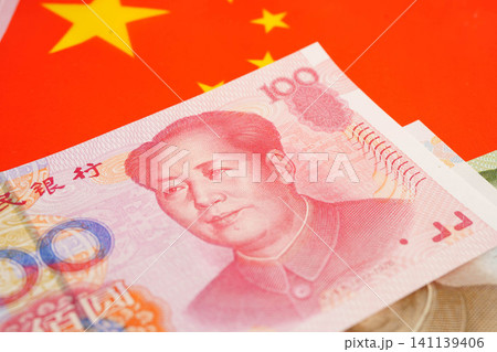 China yuan banknote money with flag, investment economy business and banking. China yuan banknote money with flag, investment economy business and banking. 141139406