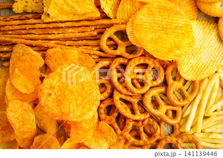 Mix of variety snack chips pretzel and cracker, junk crunchy food. 141139446