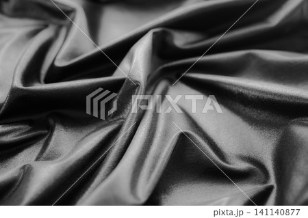 Background black silk fabric luxury abstract textile smooth shadow gradient cloth gray banner product friday presentation, canvas material template decoration elegance textile fashion sale. Background black silk fabric luxury abstract textile smooth shadow gradient cloth gray banner product friday presentation, canvas material template decoration elegance textile fashion sale. 141140877