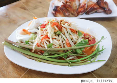 spicy salad, som tam or Thai spicy salad or papaya salad or vegetable salad spicy salad, som tam or Thai spicy salad or papaya salad or vegetable salad 141142451
