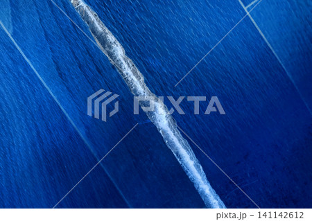 Broken torn linoleum old rubber polymer PVC floor damage material flooring repair blue object line stripe Broken torn linoleum old rubber polymer PVC floor damage material flooring repair blue object line stripe 141142612