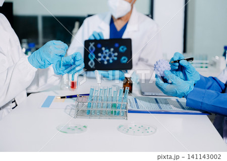 Scientists conducting laboratory research, analyzing samples in a biotech lab. Healthcare innovation, medical testing, and advanced science technology Scientists conducting laboratory research, analyzing samples in a biotech lab. Healthcare innovation, medical testing, and advanced science technology 141143002