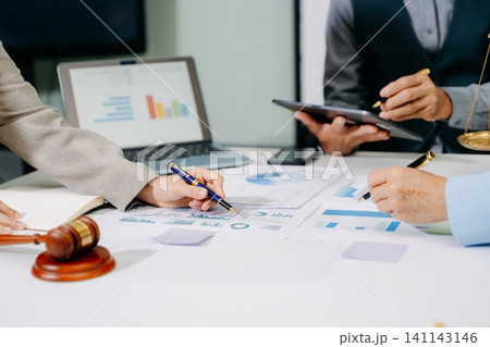 business people and lawyers discussing contract papers sitting at the table. Concepts of law, advice, legal services.in office 141143146