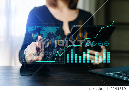 Trading growth graph on business and investment and finance business analysis stockmarket with digital tablet.digital technology Trading growth graph on business and investment and finance business analysis stockmarket with digital tablet.digital technology 141143210