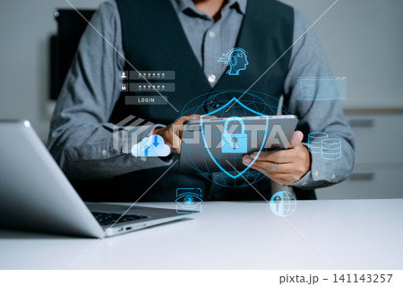 Cyber security and data protection. Business using computer and tablet protecting business and financial data with virtual from cyber attack, cybersecurity technology Cyber security and data protection. Business using computer and tablet protecting business and financial data with virtual from cyber attack, cybersecurity technology 141143257