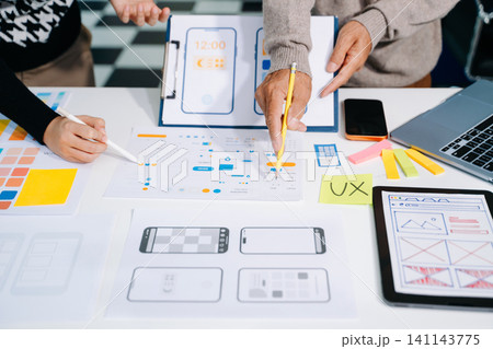 UX graphic designer planning application process development prototype wireframe for web smart phone. 141143775