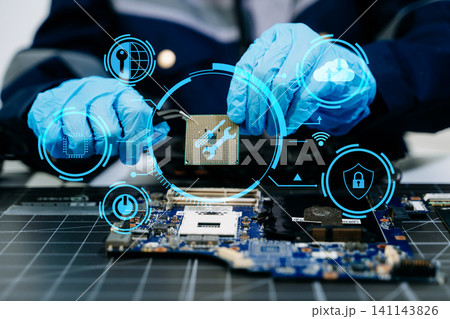 The technician is putting the CPU on the socket of the computer motherboard. electronic engineering electronic repair, electronics measuring 141143826