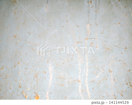 Abstract background of a weathered and distressed wall with peeling paint and plaster in faded light blue and beige tones, showcasing aged texture and grunge details. Abstract background of a weathered and distressed wall with peeling paint and plaster in faded light blue and beige tones, showcasing aged texture and grunge details. 141144529
