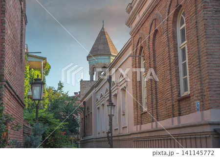 Old Tbilisi narrow street with brick building and church tower with copy space Old Tbilisi narrow street with brick building and church tower with copy space 141145772