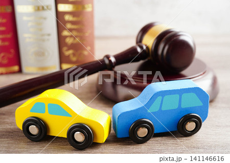 Car accident lawsuit and insurance, Judge hammer with car model. 141146616