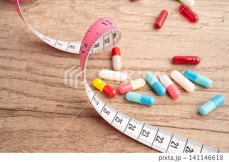 Measuring tape and tablet drug medical for diet. 141146618