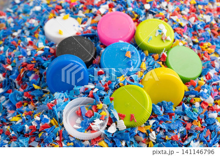 Bangkok, Thailand April 20, 2024 Plastic recycle pellets and caps for industrial use. Bangkok, Thailand April 20, 2024 Plastic recycle pellets and caps for industrial use. 141146796