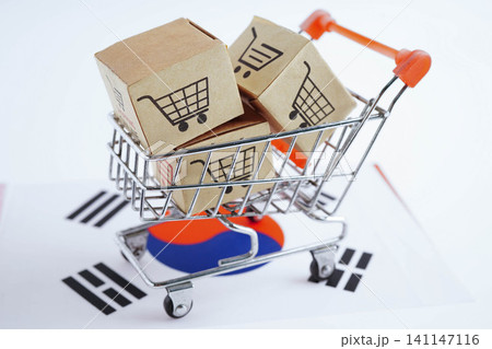 Online shopping, Shopping cart box on South Korea  flag, import export, finance commerce. 141147116