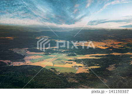 Aerial view of lush green forests and agricultural fields near Oslo. Aerial view of lush green forests and agricultural fields near Oslo. 141150387
