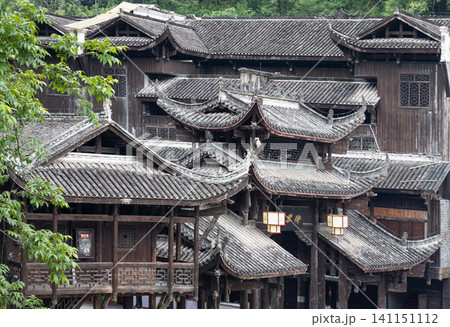 Intricate vernacular timber architecture showcasing the complex interlocking frames and hanging pavilions (Diaojiaolou) typical of the Miao ethnic minority culture. 141151112