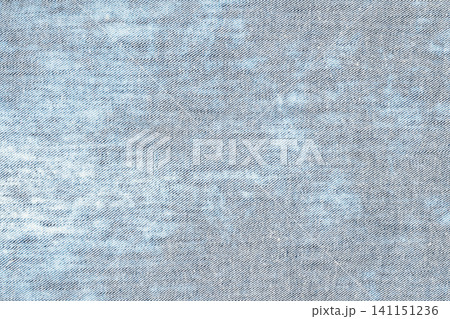 Closeup of light blue denim fabric texture with diagonal weave pattern Closeup of light blue denim fabric texture with diagonal weave pattern 141151236