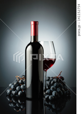Red wine and juicy blue grapes. Red wine and juicy blue grapes. 141152754