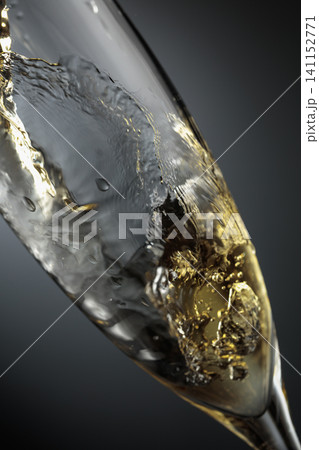 White sparkling wine is poured into a glass. White sparkling wine is poured into a glass. 141152771