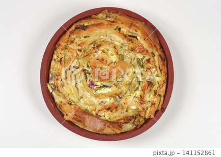 Baked Savory Spiral Pastry with Cheese and Vegetables in a Round Pan Baked Savory Spiral Pastry with Cheese and Vegetables in a Round Pan 141152861