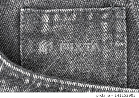 Denim fabric texture with coin pocket detail in top view 141152903