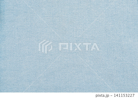Light blue fabric texture with diagonal weave pattern Light blue fabric texture with diagonal weave pattern 141153227