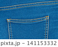 Blue denim jeans texture with back pocket and orange stitching 141153332