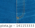 Classic blue denim background with golden thread seam on fly 141153333